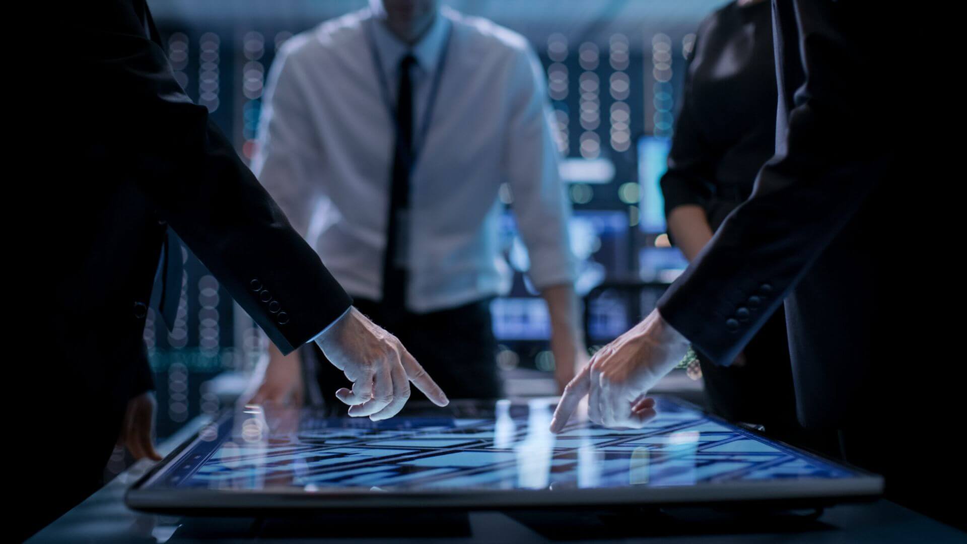 Two IT Professionals Collaborating on A Computer Screen Discussing Business Strategies