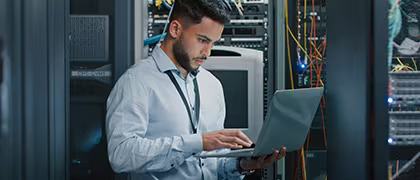 Man with laptop standing