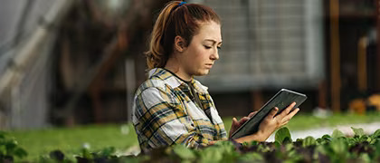 woman standing with tablet