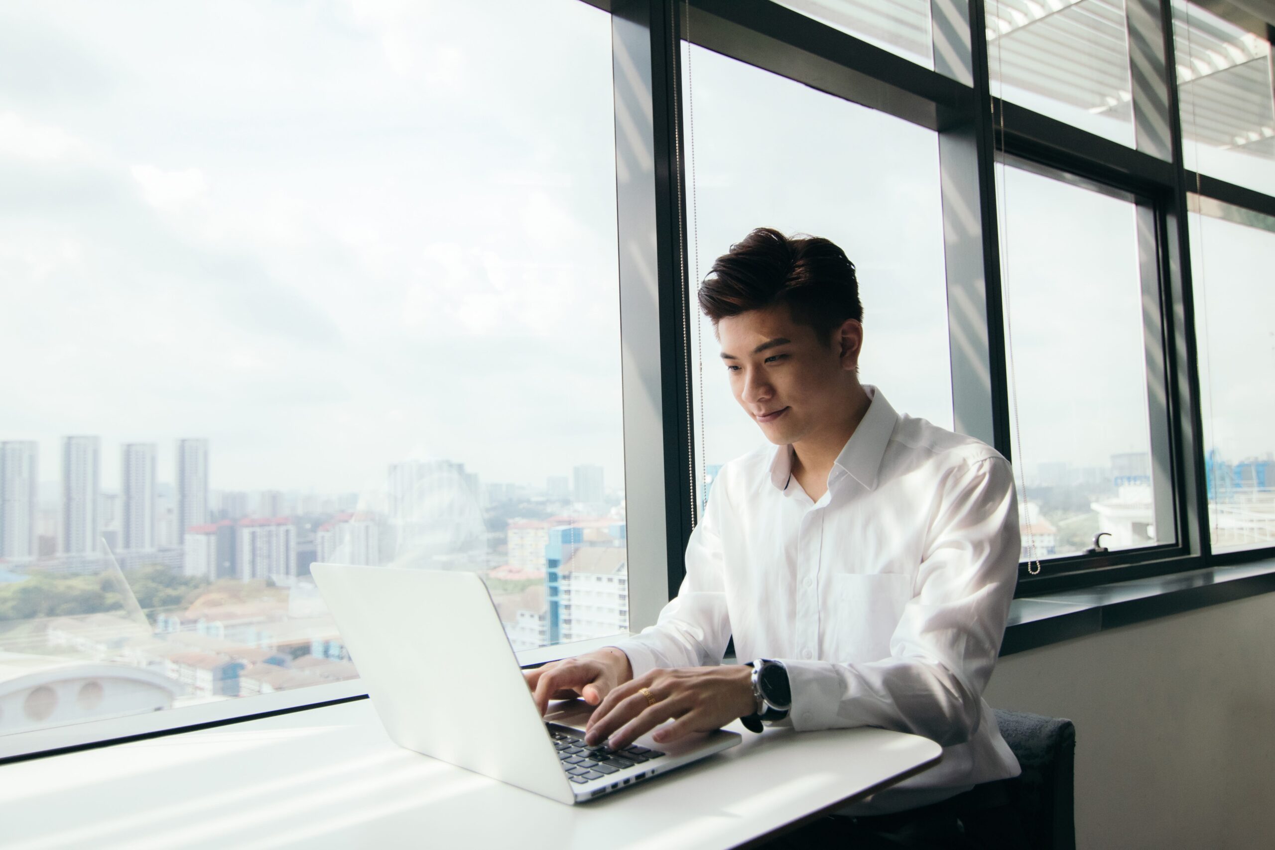 asian man professional working on laptop